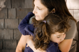 Woman and toddler hugging