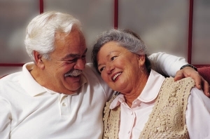 Elderly man and woman smiling