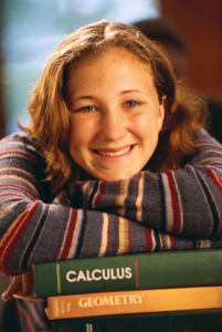 Student smiling with her textbooks